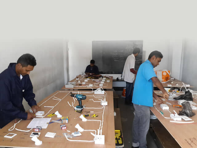 Young men learning essential skills at the Al-Zohra Sadiq Vocational Institue