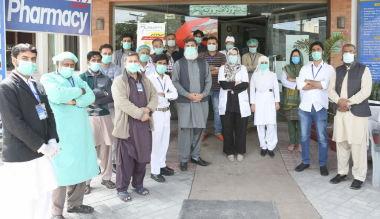 Volunteer healthcare workers at Muazzam Hospital providing emergency medical aid