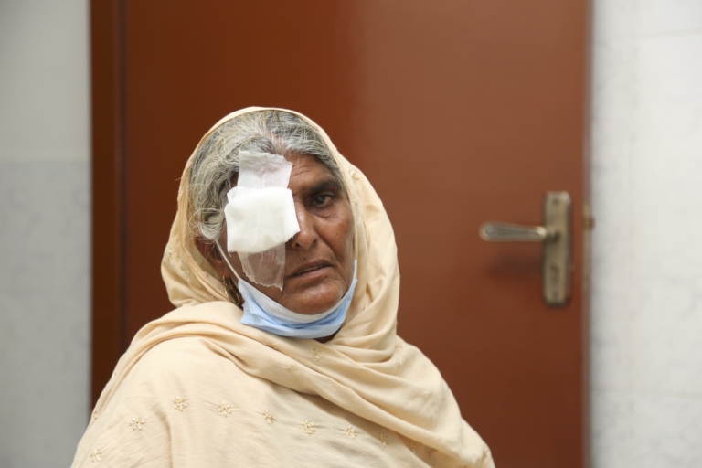 A woman with an eye bandage at Muazzam Foundation's Eye & Medical Camp