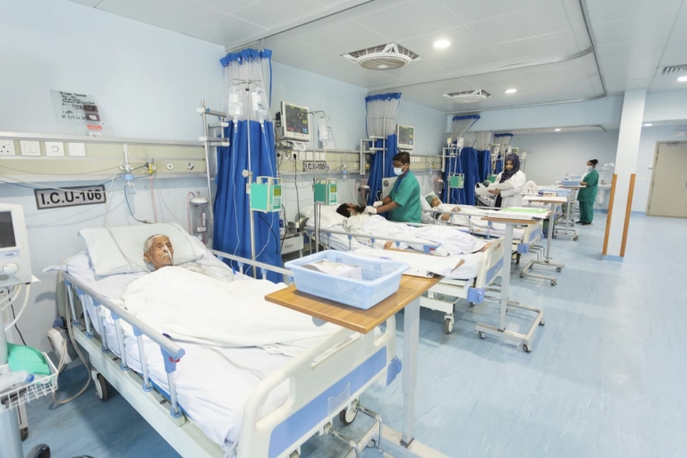 Old patients lying in hospital beds in the Intensive Care Unit at the Muazzam Hospital