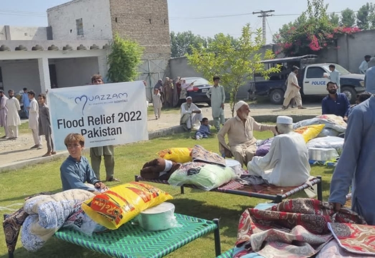 People receiving beds, food, duvets and blankets through Muazzam Foundation's natural disaster relief projects.