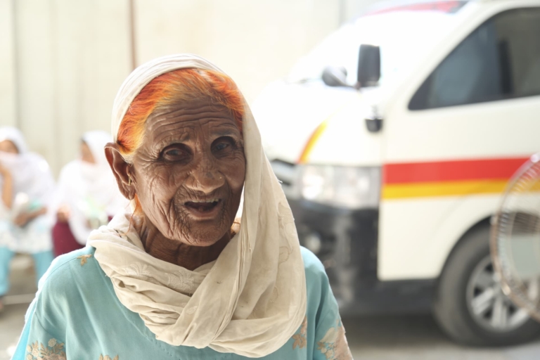 An elderly widow smiling