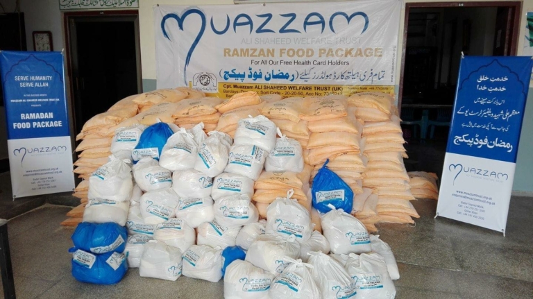 Packages of food stacked up for charity by Muazzam Foundation